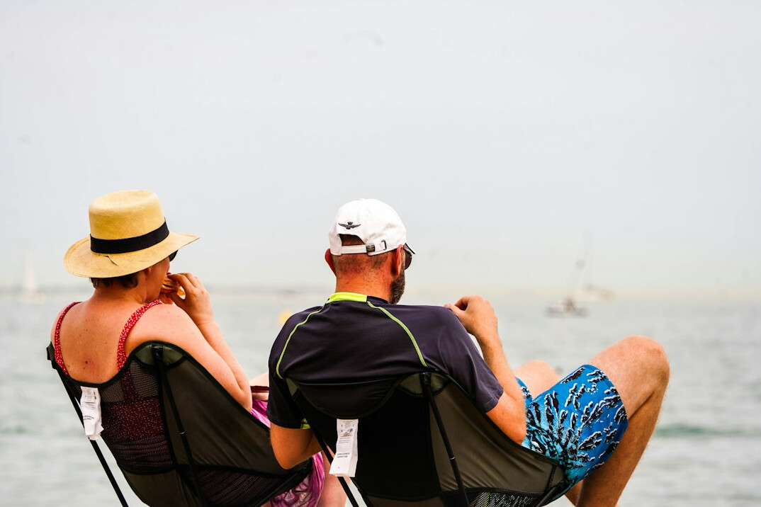 senior couple relaxing on beach