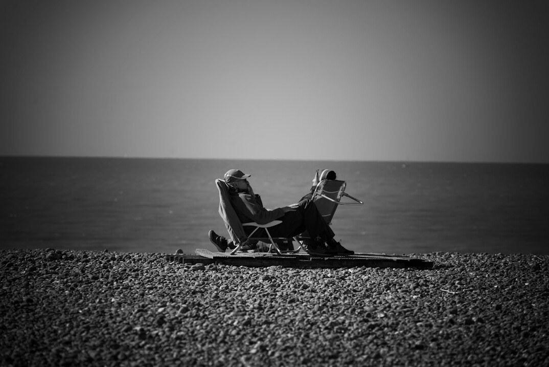 senior couple relaxing on beach