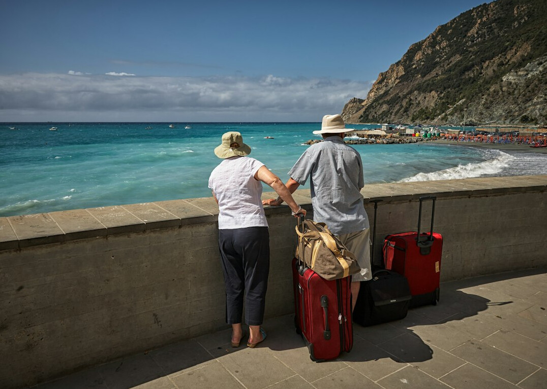 happy retired couple traveling