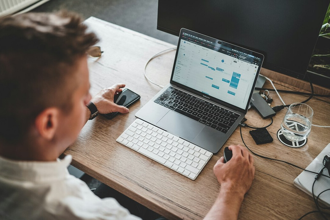 person using retirement calculator on laptop